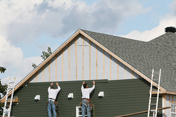Professional Storm Damage Siding Repair technician working in Woodford, VA